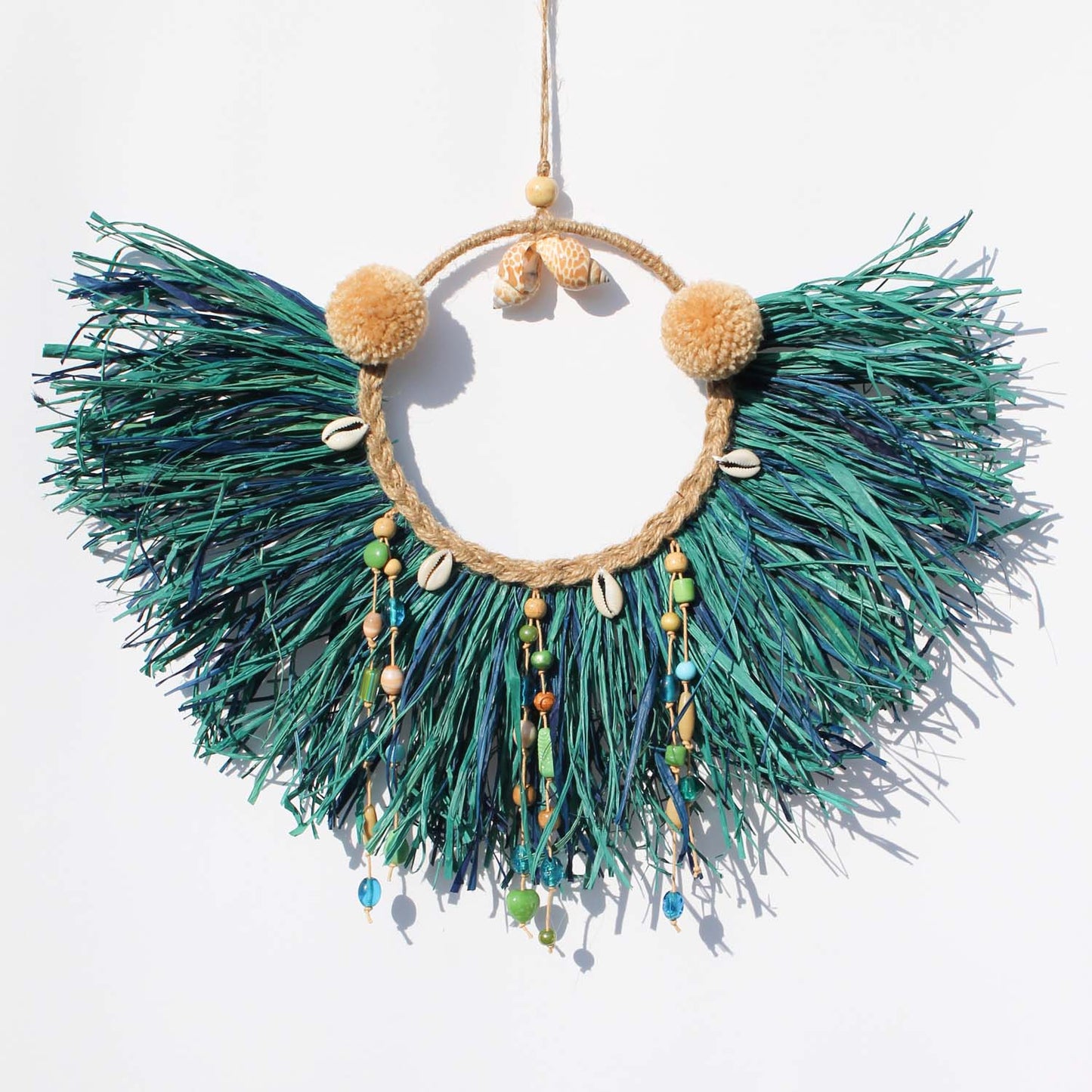Caribbean-Inspired Boho Wall Decor with Shells and Pom Poms