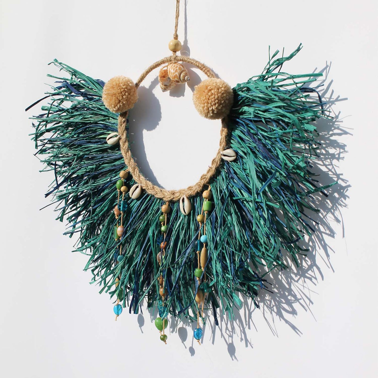 Caribbean-Inspired Boho Wall Decor with Shells and Pom Poms