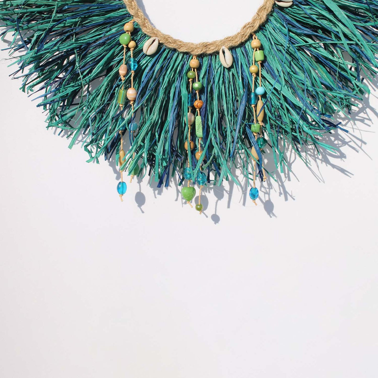 Caribbean-Inspired Boho Wall Decor with Shells and Pom Poms