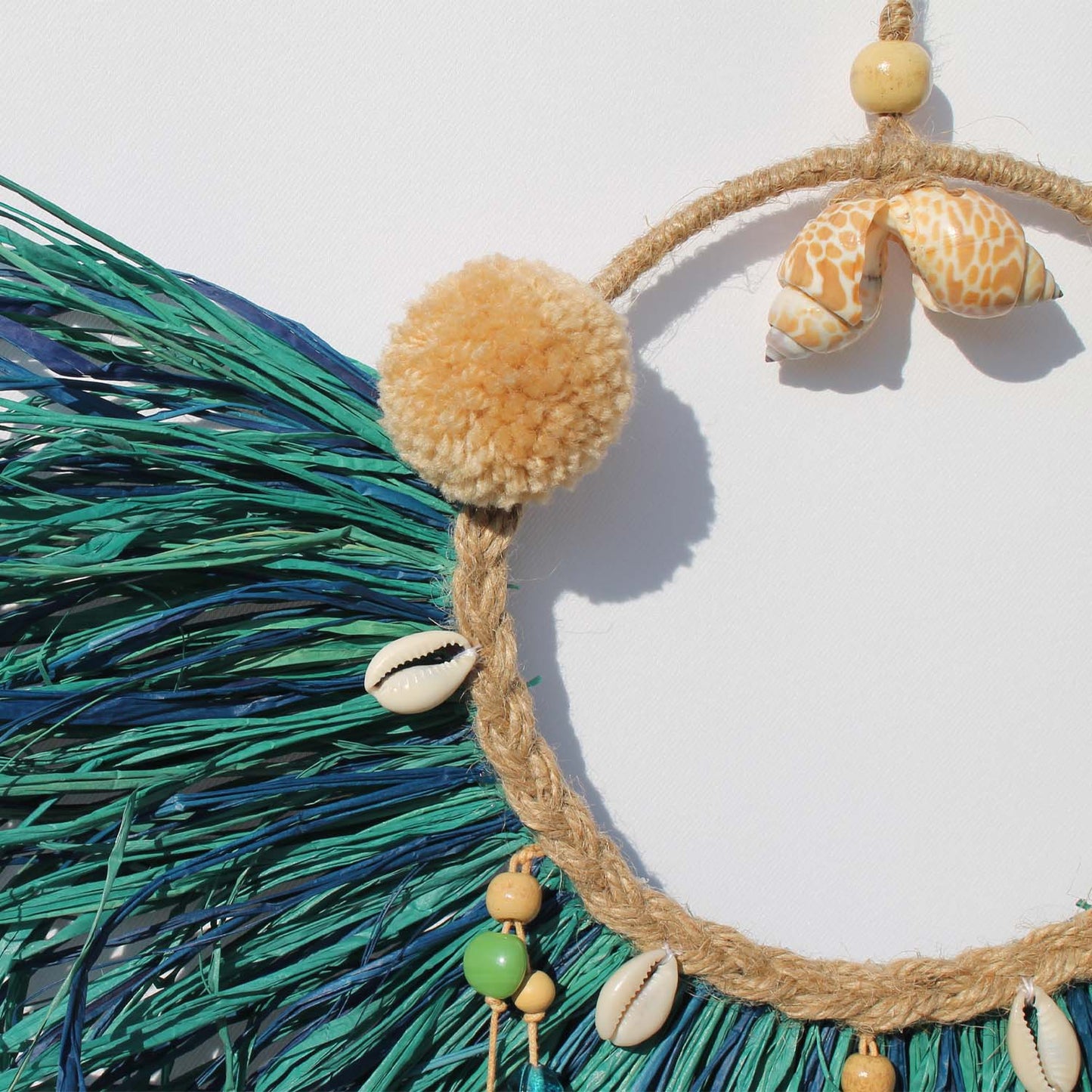 Caribbean-Inspired Boho Wall Decor with Shells and Pom Poms