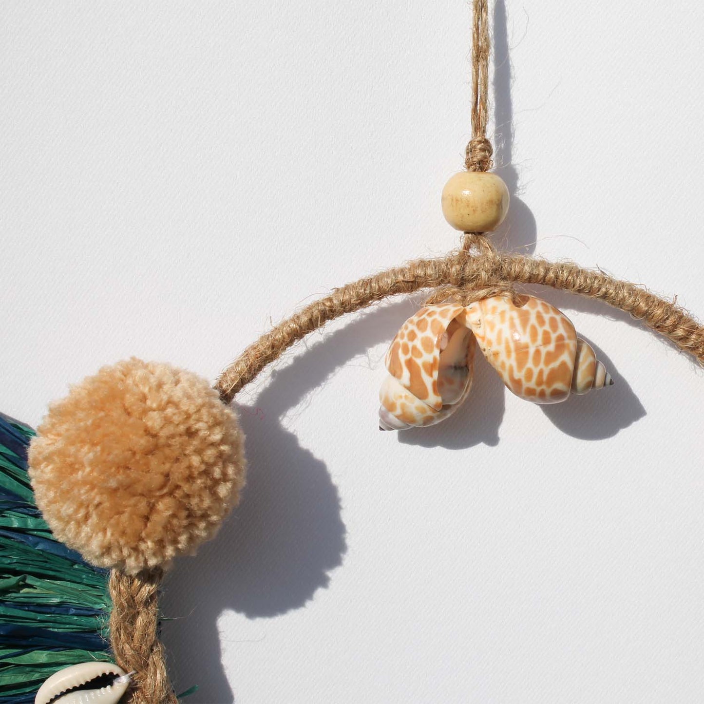 Caribbean-Inspired Boho Wall Decor with Shells and Pom Poms