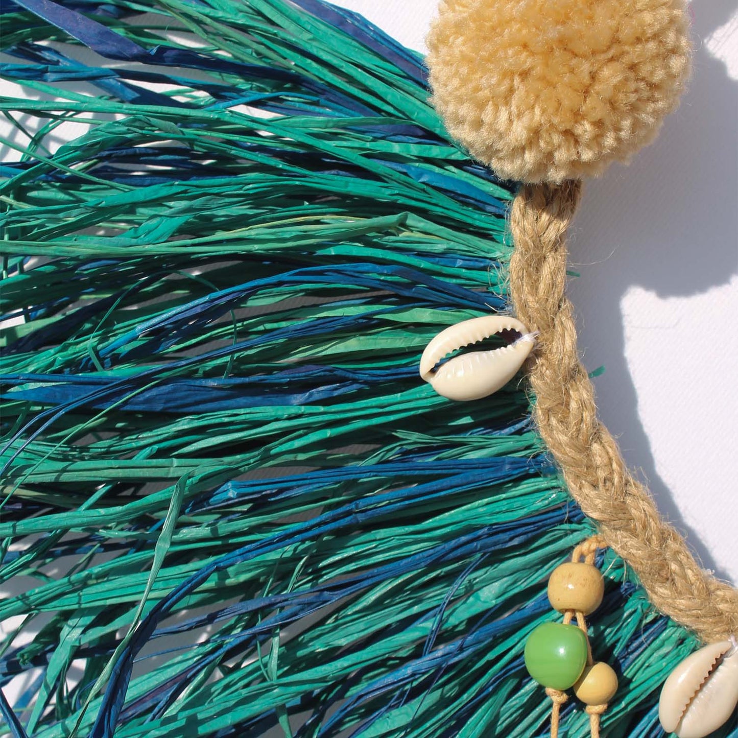 Caribbean-Inspired Boho Wall Decor with Shells and Pom Poms