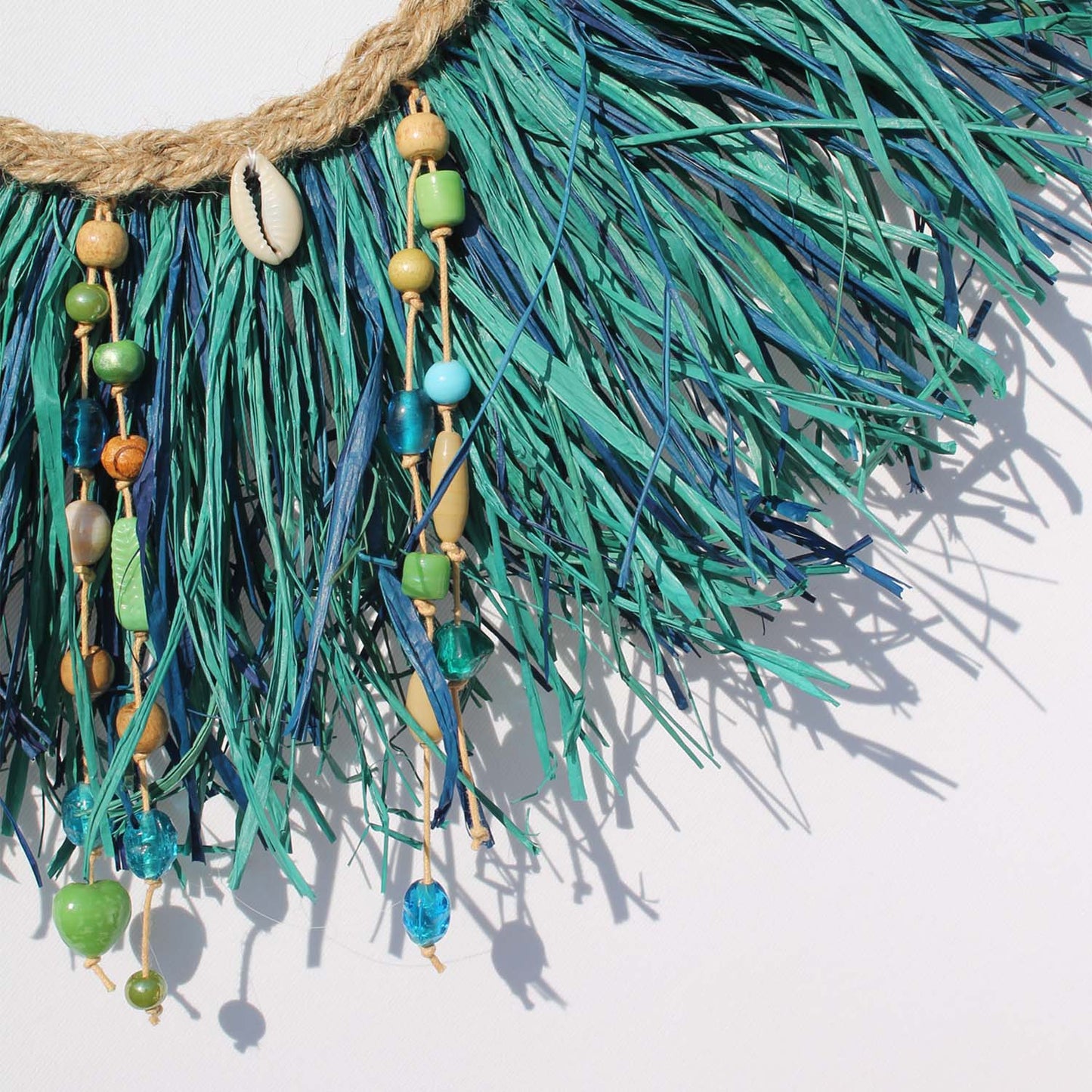 Caribbean-Inspired Boho Wall Decor with Shells and Pom Poms
